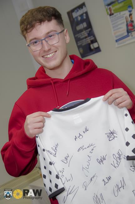 Joel Williams proudly displays the Haverfordwest County signed shirt on his special night at the Bridge Meadow Stadium